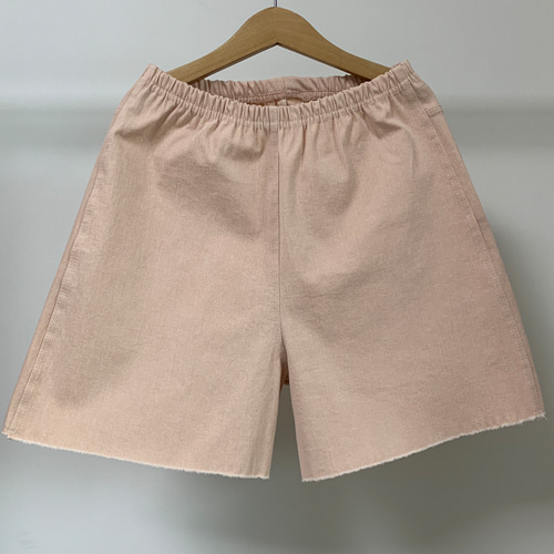 span shorts peach